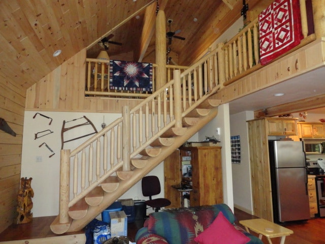 Evergreen home indoor wood staircase to upper loft